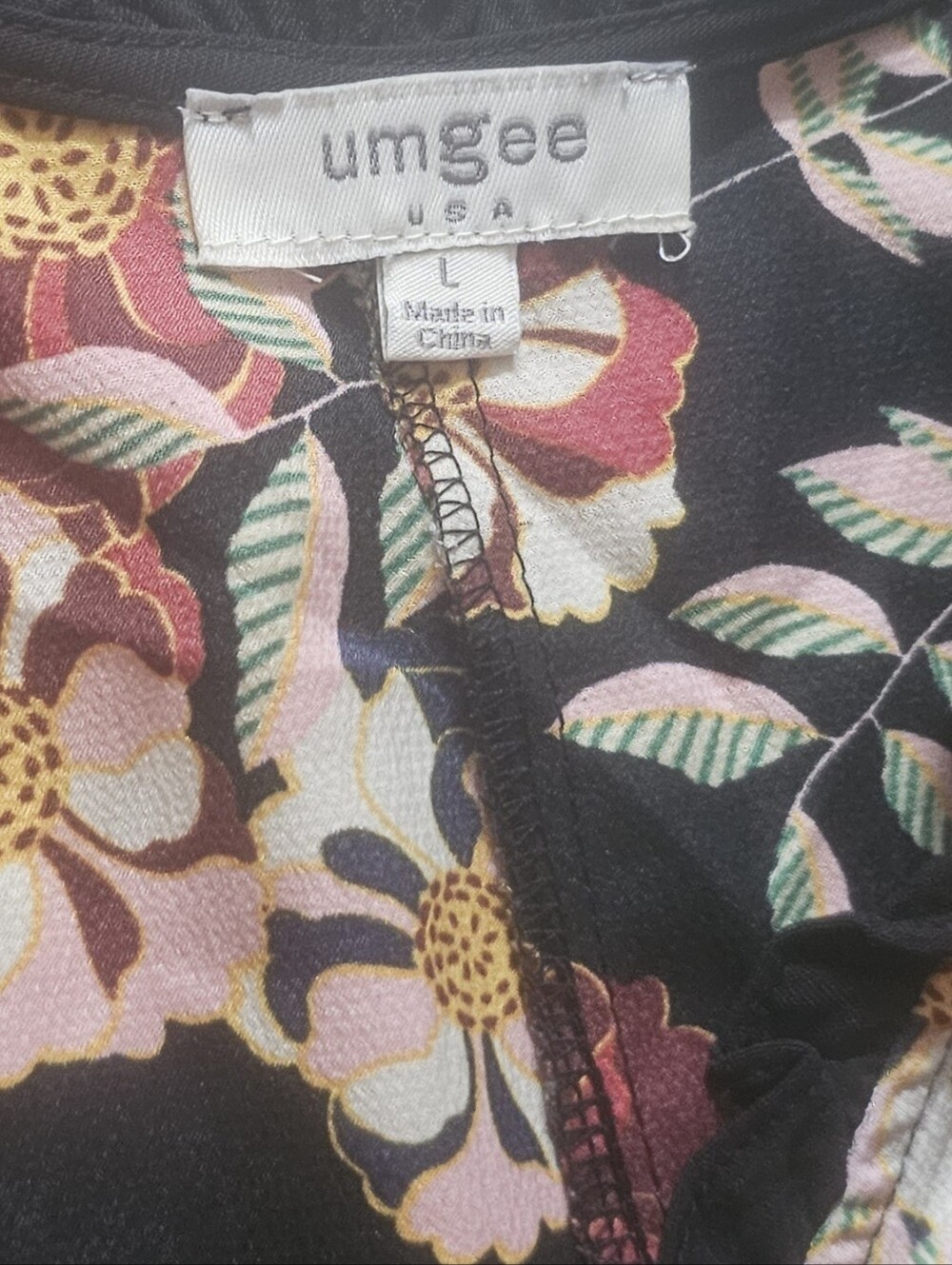 Umgee babydoll blouse features a bold, mixed design combining bohemian andanimal - Picture 8 of 10